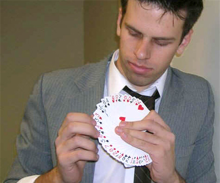 WSU junior Mark Toland works as the resident magician at Stevens Magic Emporium in Wichita.