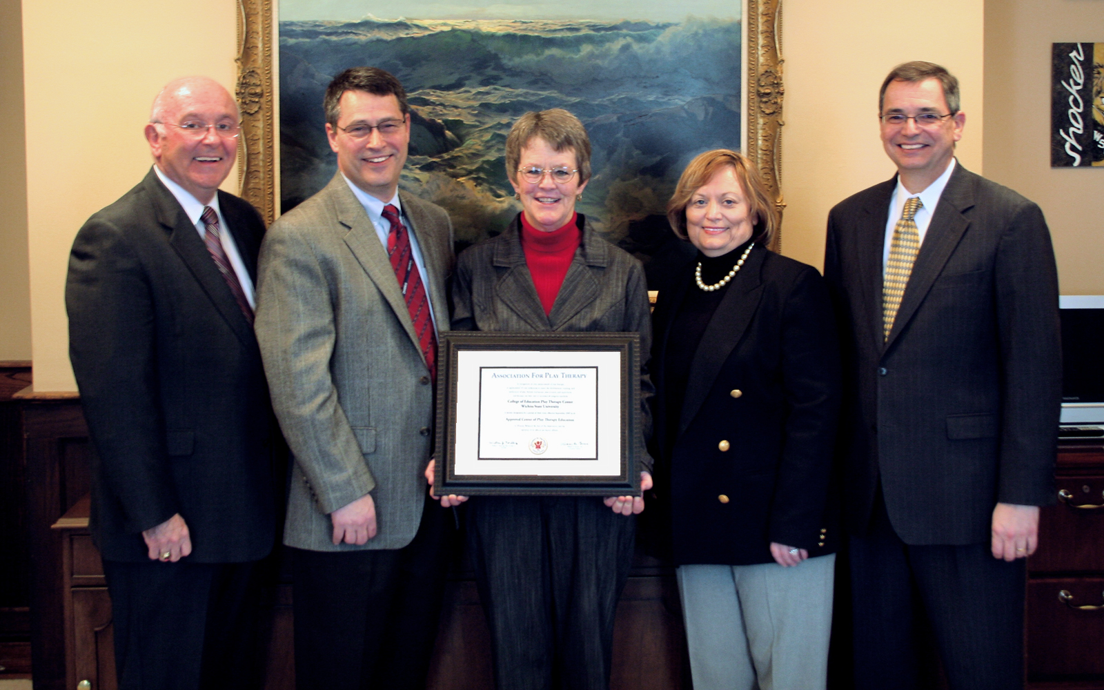 Center director Ruth Hitchcock (center) flanked by (l-r) WSU President Donald Beggs, Adjunct Faculty and Community Partner Richard Gaskill, College of Education Dean Sharon Iorio, and Provost and Vice President for Academic Affairs and Research Gary L. Miller.