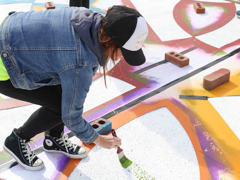 Students paint a street mural
