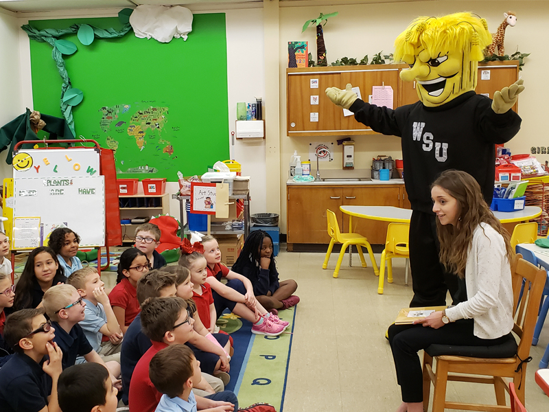 The PRI's Meghan Carver and WuShock speak with a local elementary school class.