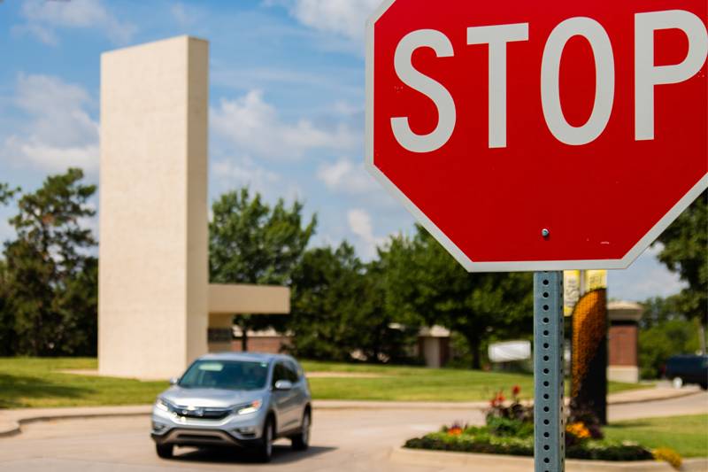 New stop signs facing Perimeter Road on Memorial Drive