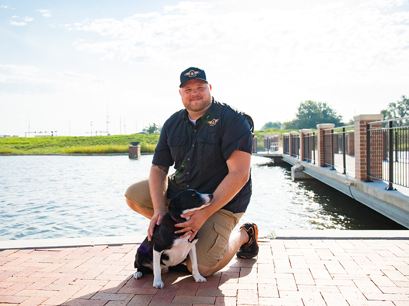 Chris Stoneberger, and Quinn, the Goose Dog