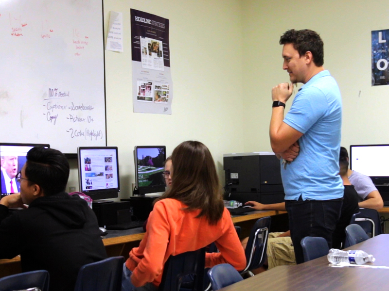 Austin Clift instructs students in his photo imaging class at Wichita East High School