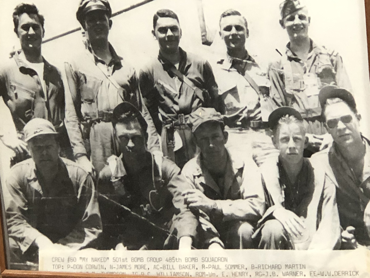A framed photo of Martin's crew of ten men during World War II.
