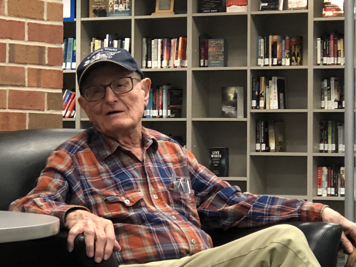 Richard Martin, World War II veteran, served on a B-29 bomber over Japan. In this image, he speaks to the class in the Ablah Library C-Space.