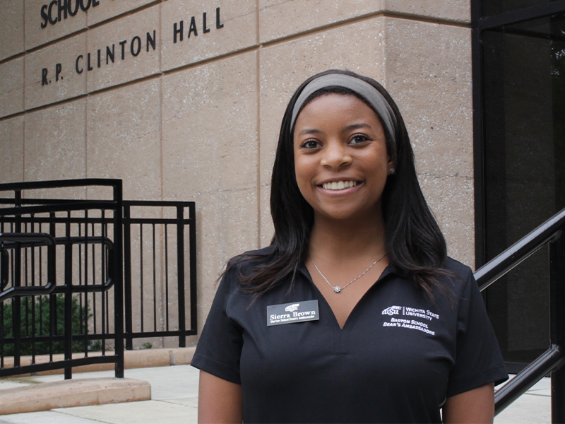 Sierra Brown standing in front of Clinton Hall