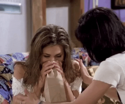 Rachel from friends breathing into a paper bag