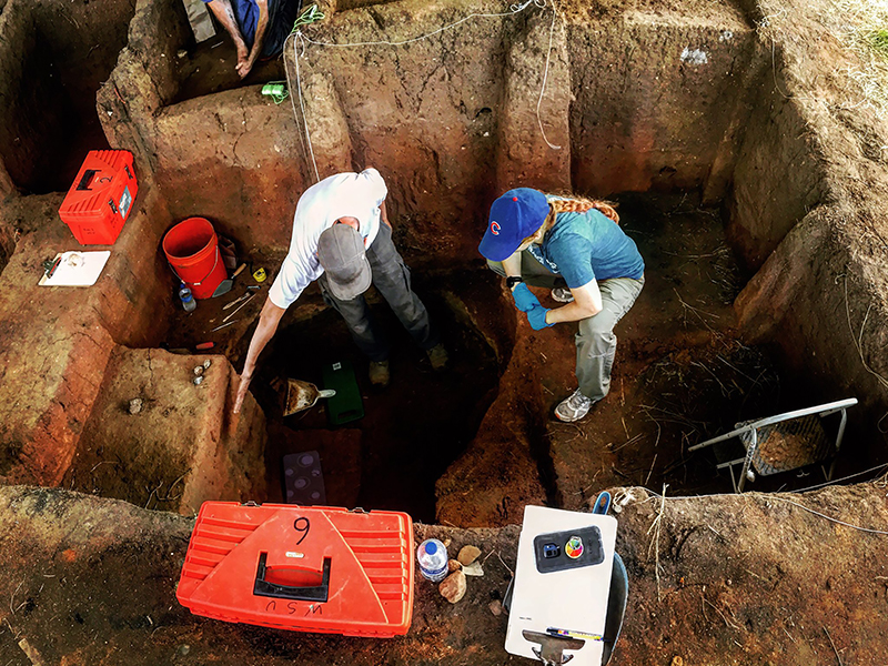 Archaeology researchers digging underground