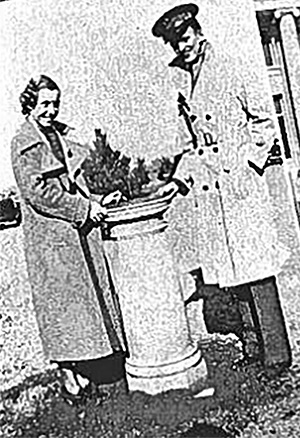 This photo featured in Wichita State's 1935 Parnassus yearbook shows two students standing with the sundial that was dedicated to the university by the class of 1934. 