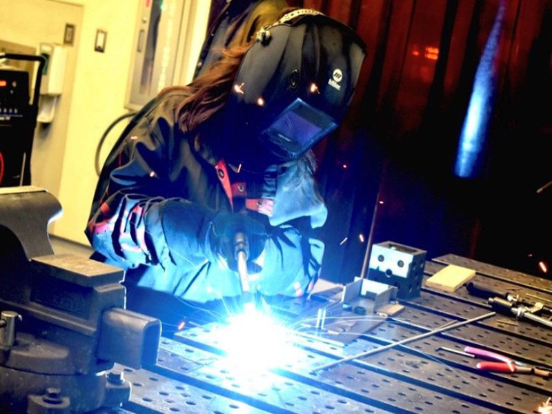 A Wichita State student welds as part of a class project at GoCreate located at the Innovation Campus.