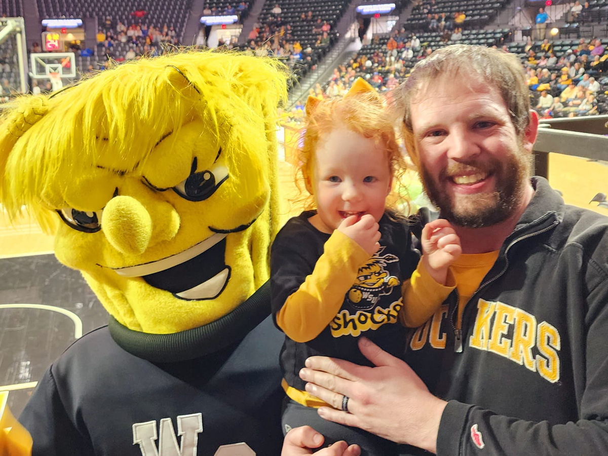 Zachary Brown with his daughter and Wu