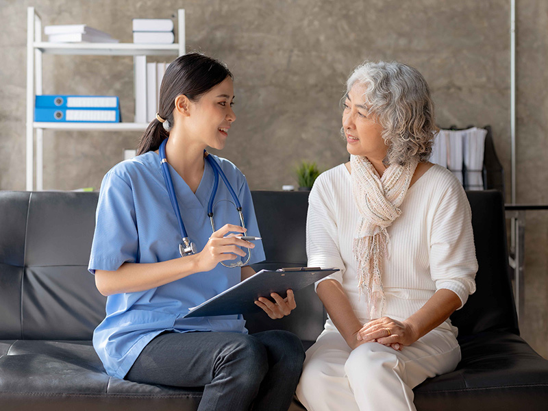 Mental health technician speaks with patient