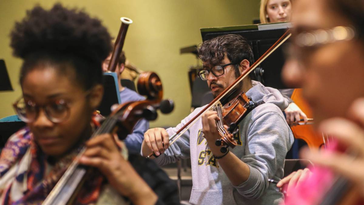 orchestra students practicing