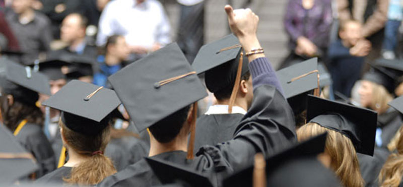 Students wearing graduation hats Students wearing graduation hats