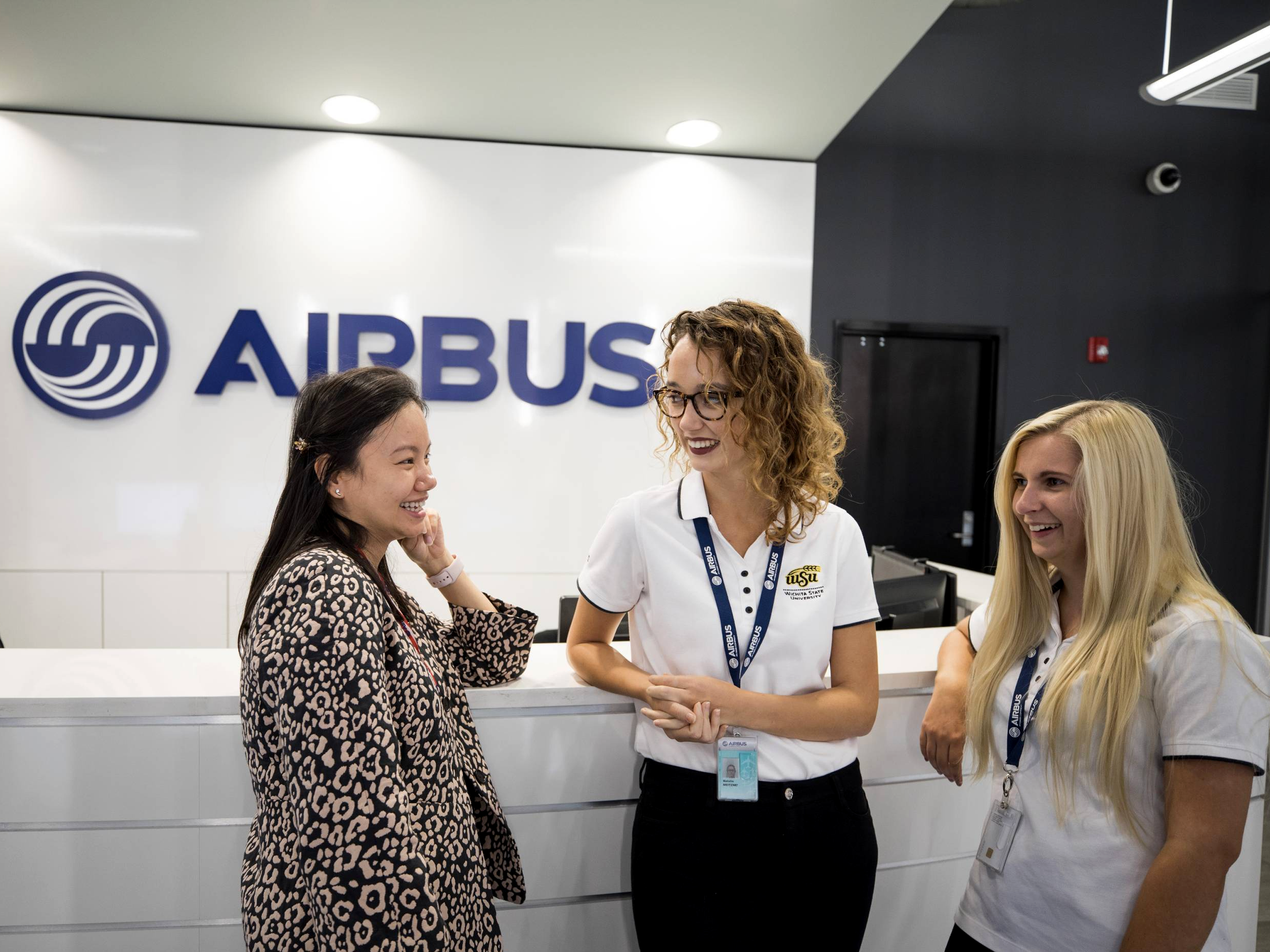 WSU Student getting instruction in manufacturing setting