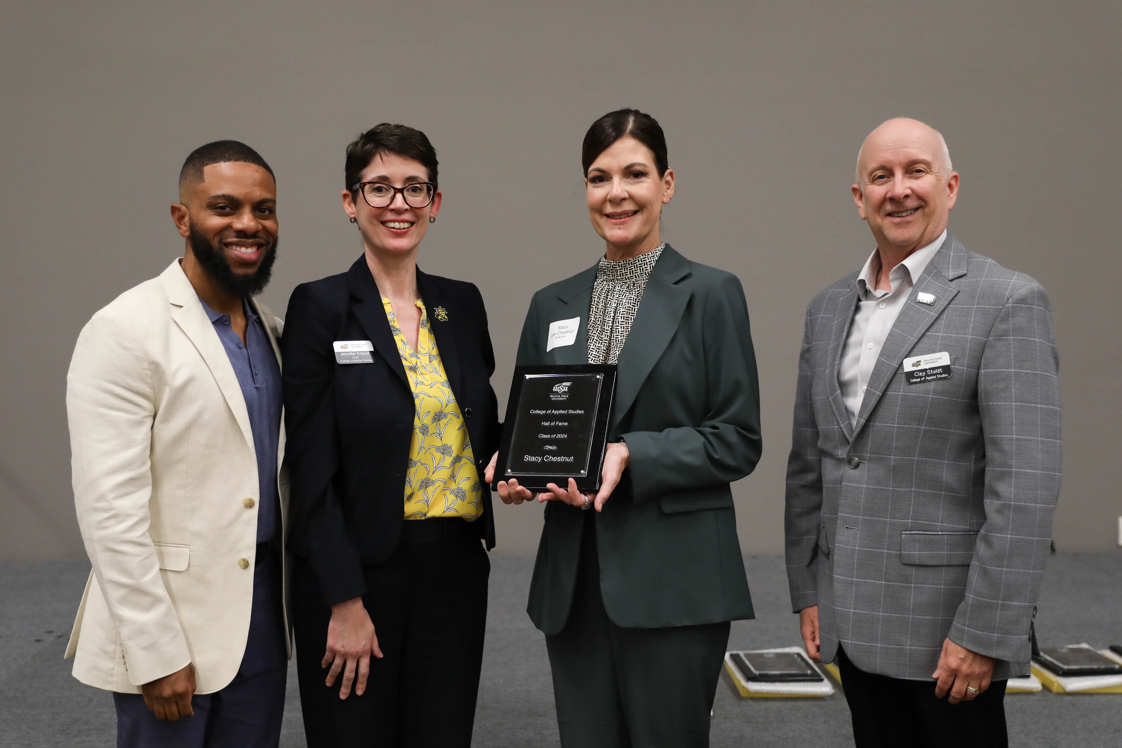 2024 CAS Hall of Fame Inductee, Stacy Chestnut being recognized and receiving her award plaque alongside CAS Assistant Dean Dr. Bobby Berry, CAS Dean Dr. Jennifer Friend, and CAS Associate Dean, Dr. Clay Stoldt at the Hall of Fame Induction Ceremony