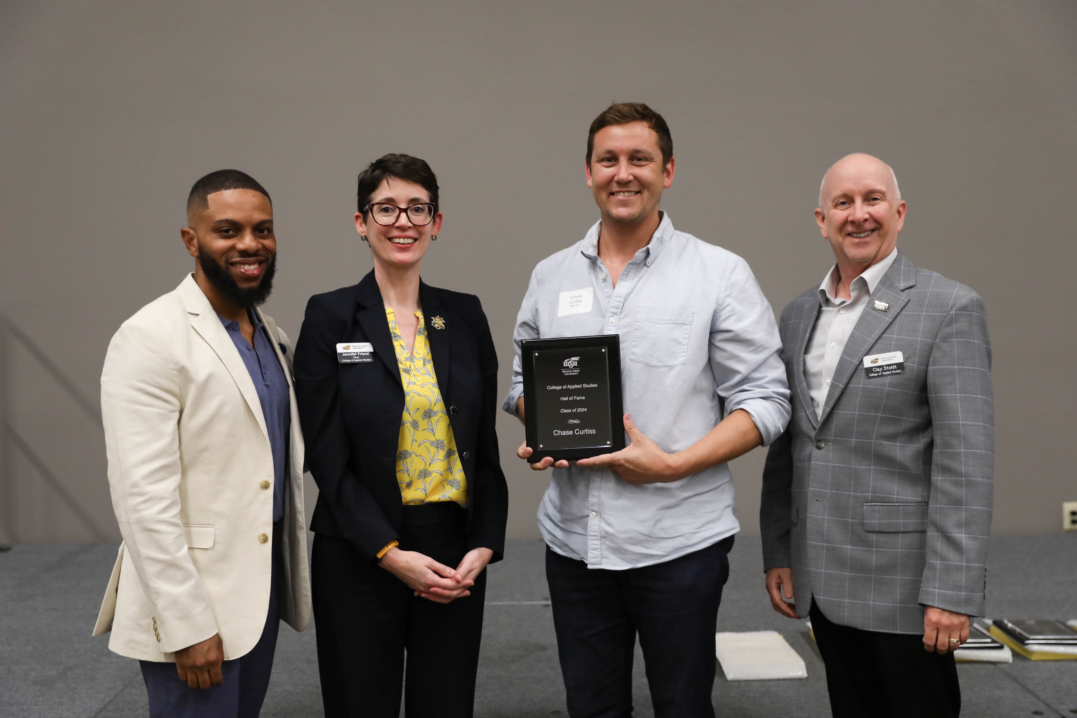 2024 CAS Hall of Fame Inductee, Chase Curtiss being recognized and receiving his award plaque alongside CAS Assistant Dean Dr. Bobby Berry, CAS Dean Dr. Jennifer Friend, and CAS Associate Dean, Dr. Clay Stoldt at the Hall of Fame Induction Ceremony