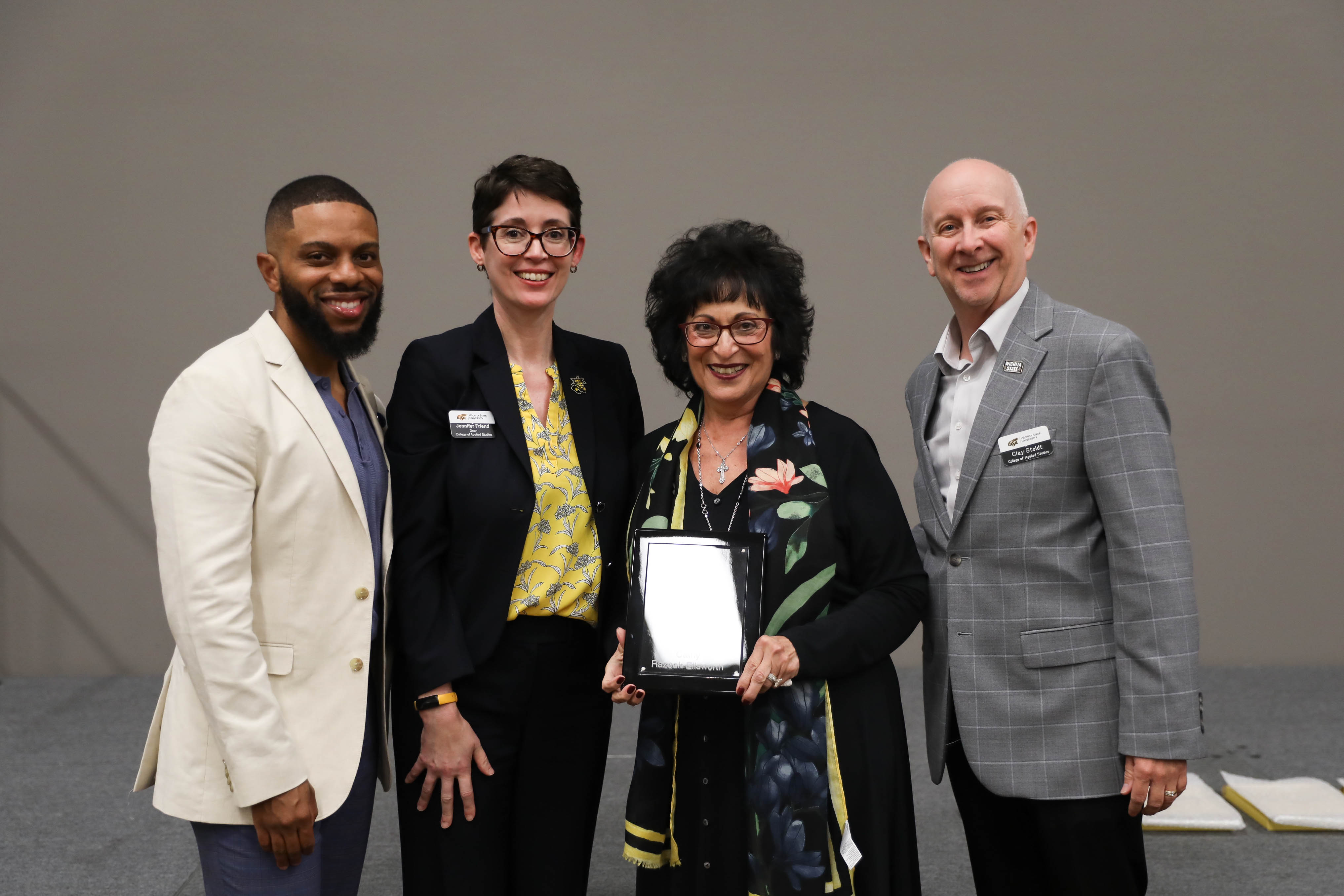 2024 CAS Hall of Fame Inductee, Cathy Razook-Ellsworth being recognized and receiving her award plaque alongside CAS Assistant Dean Dr. Bobby Berry, CAS Dean Dr. Jennifer Friend, and CAS Associate Dean, Dr. Clay Stoldt at the Hall of Fame Induction Ceremony