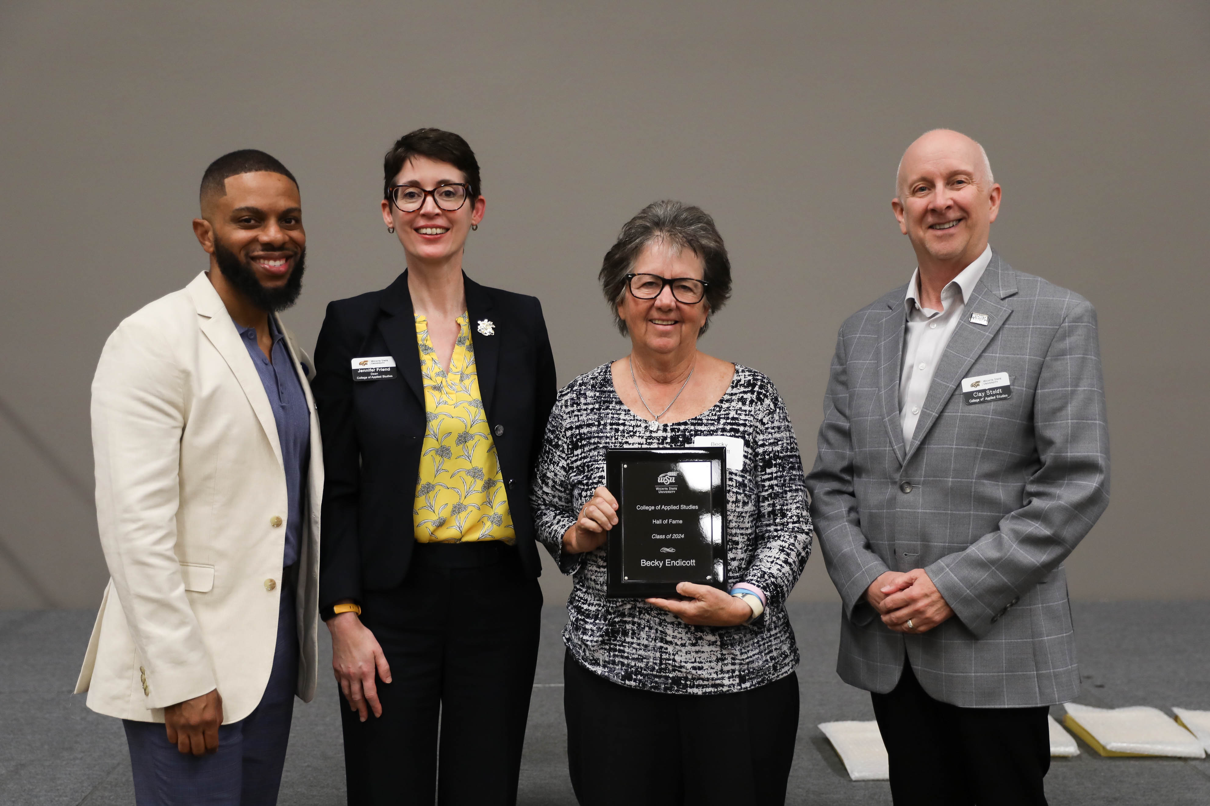 2024 CAS Hall of Fame Inductee, Becky Endicott, being recognized and receiving her award plaque alongside CAS Assistant Dean Dr. Bobby Berry, CAS Dean Dr. Jennifer Friend, and CAS Associate Dean, Dr. Clay Stoldt at the Hall of Fame Induction Ceremony