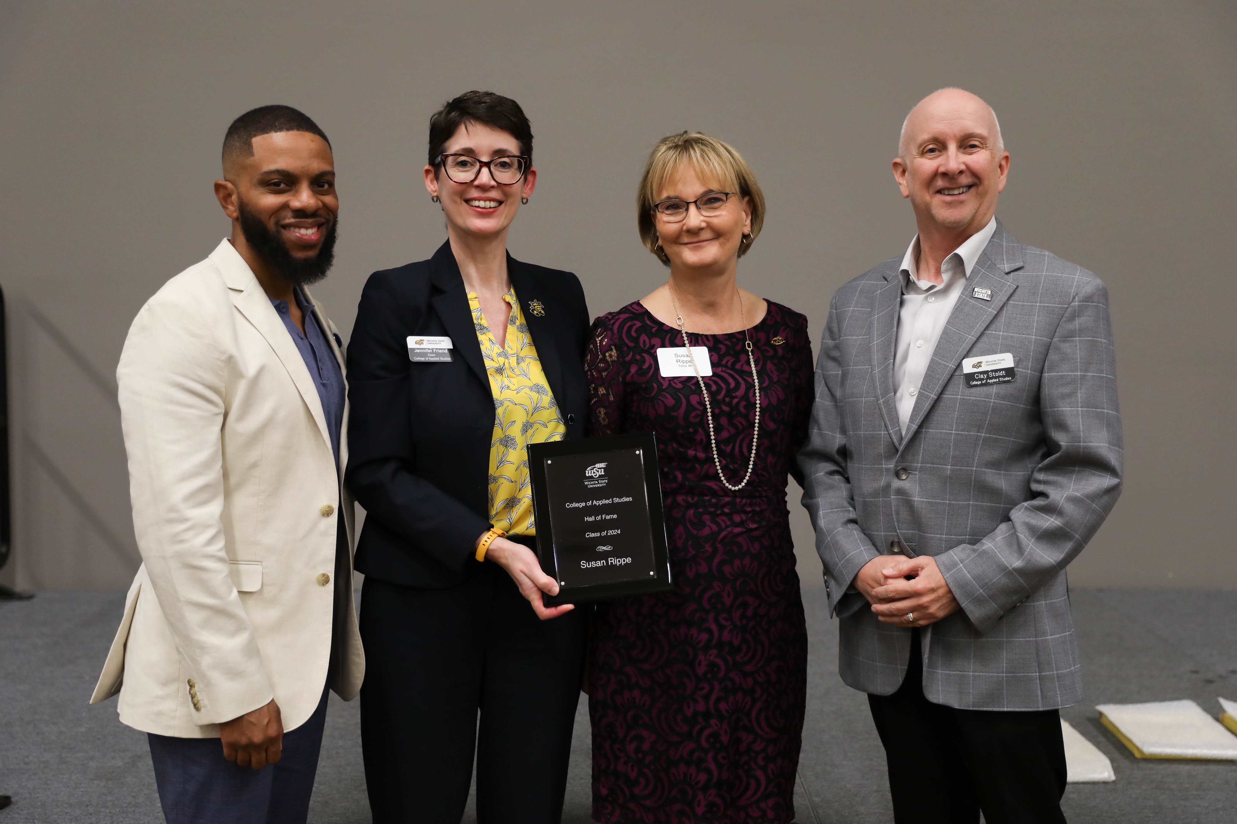 2024 CAS Hall of Fame Inductee, Susan Rippe being recognized and receiving her award plaque alongside CAS Assistant Dean Dr. Bobby Berry, CAS Dean Dr. Jennifer Friend, and CAS Associate Dean, Dr. Clay Stoldt at the Hall of Fame Induction Ceremony