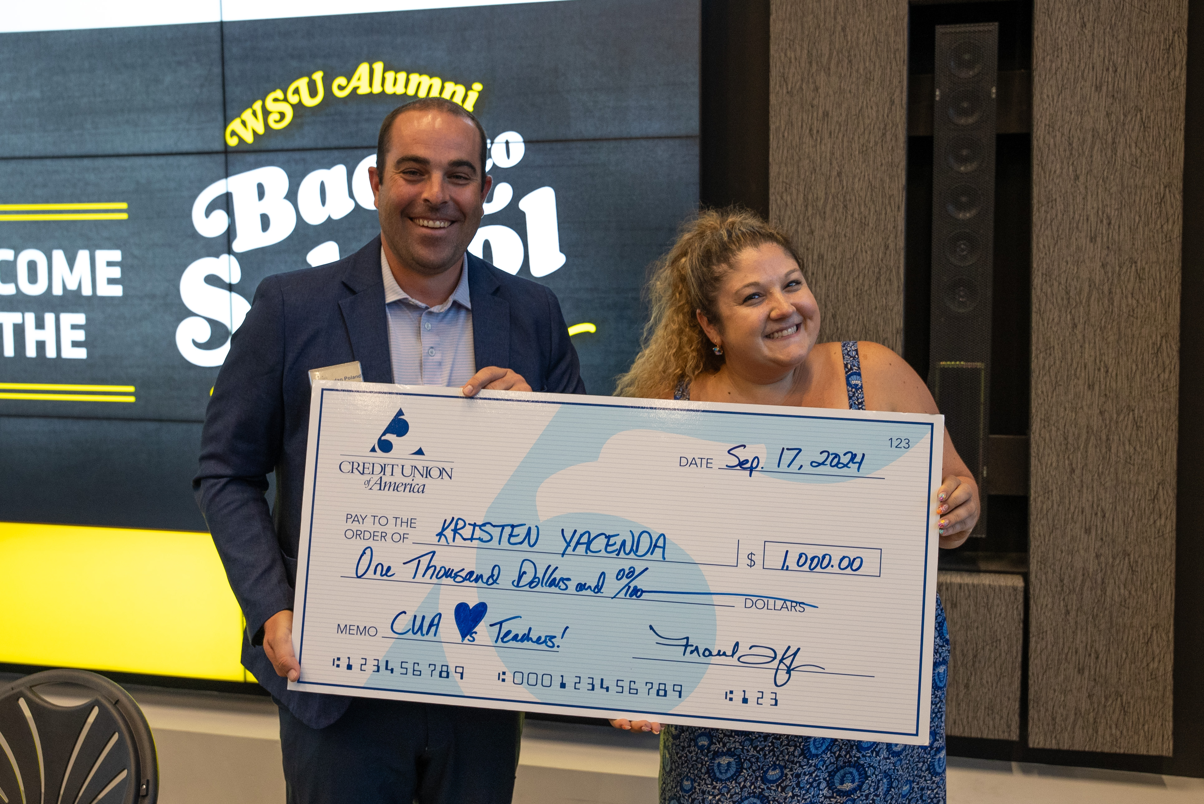 Kristen with her check