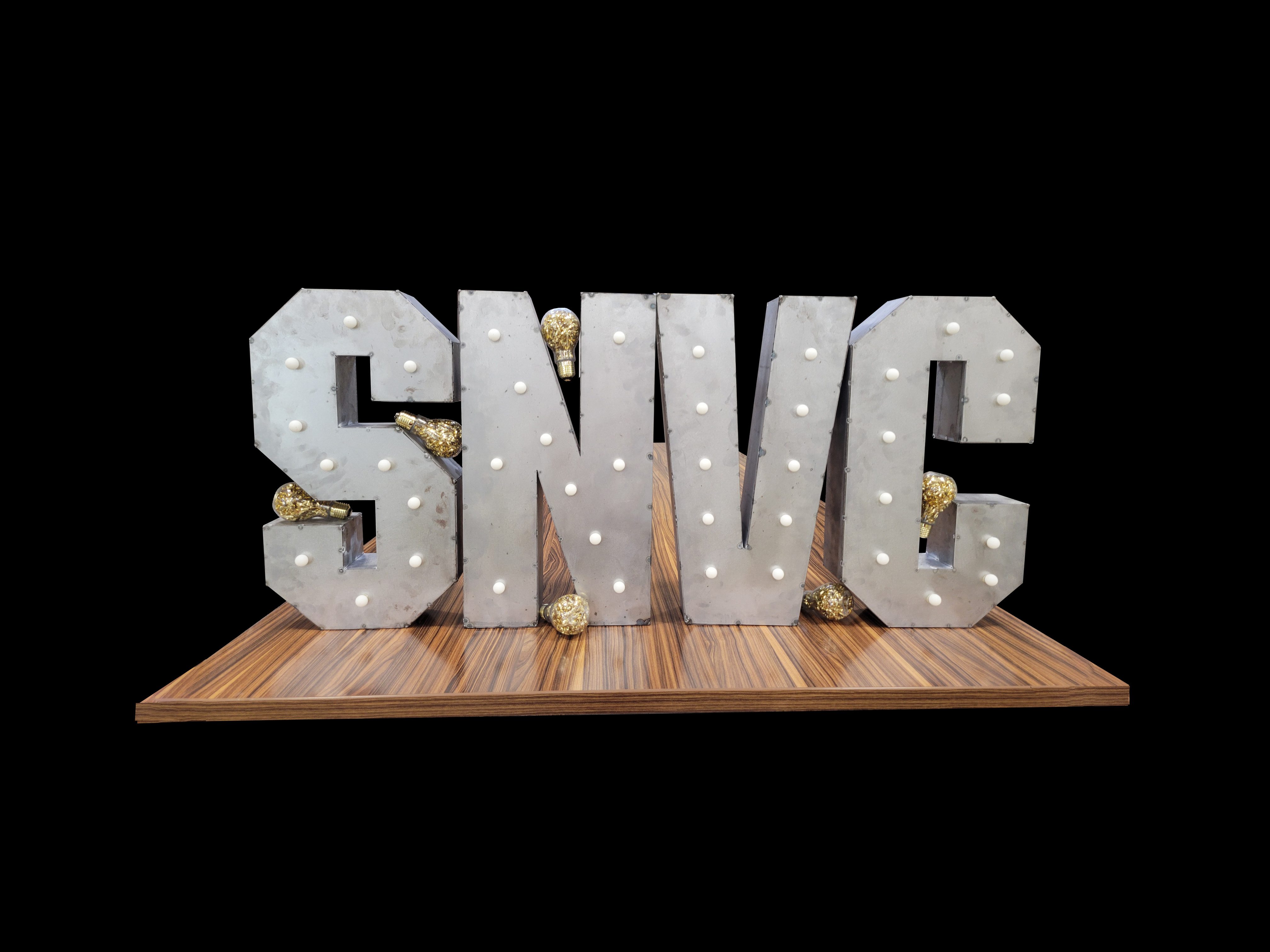 A volunteer putting together the SNVC metal display that sits in the Devlin Hall Lobby during Finals.