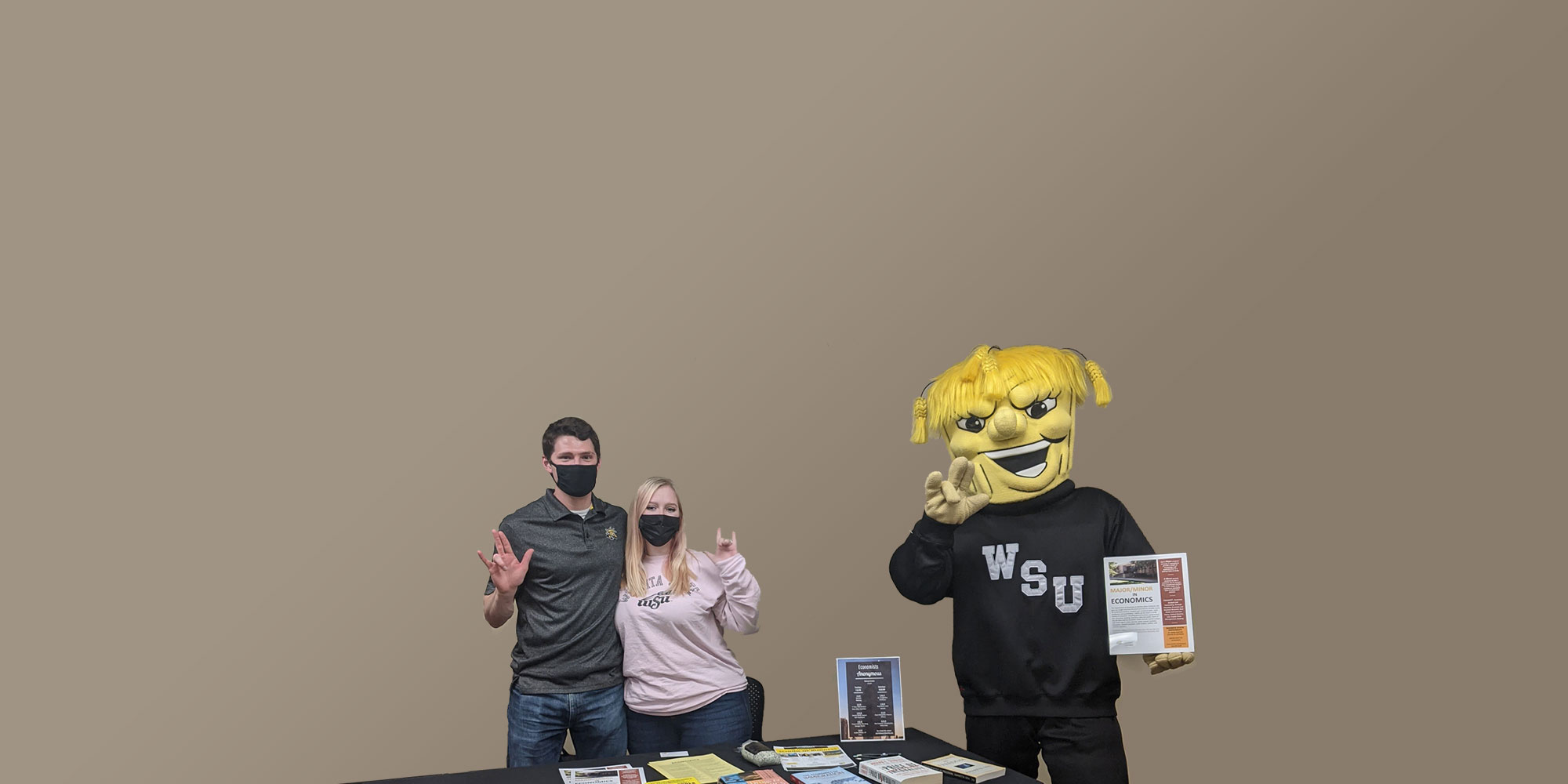 Economics Anonymous table with WuShock and students.