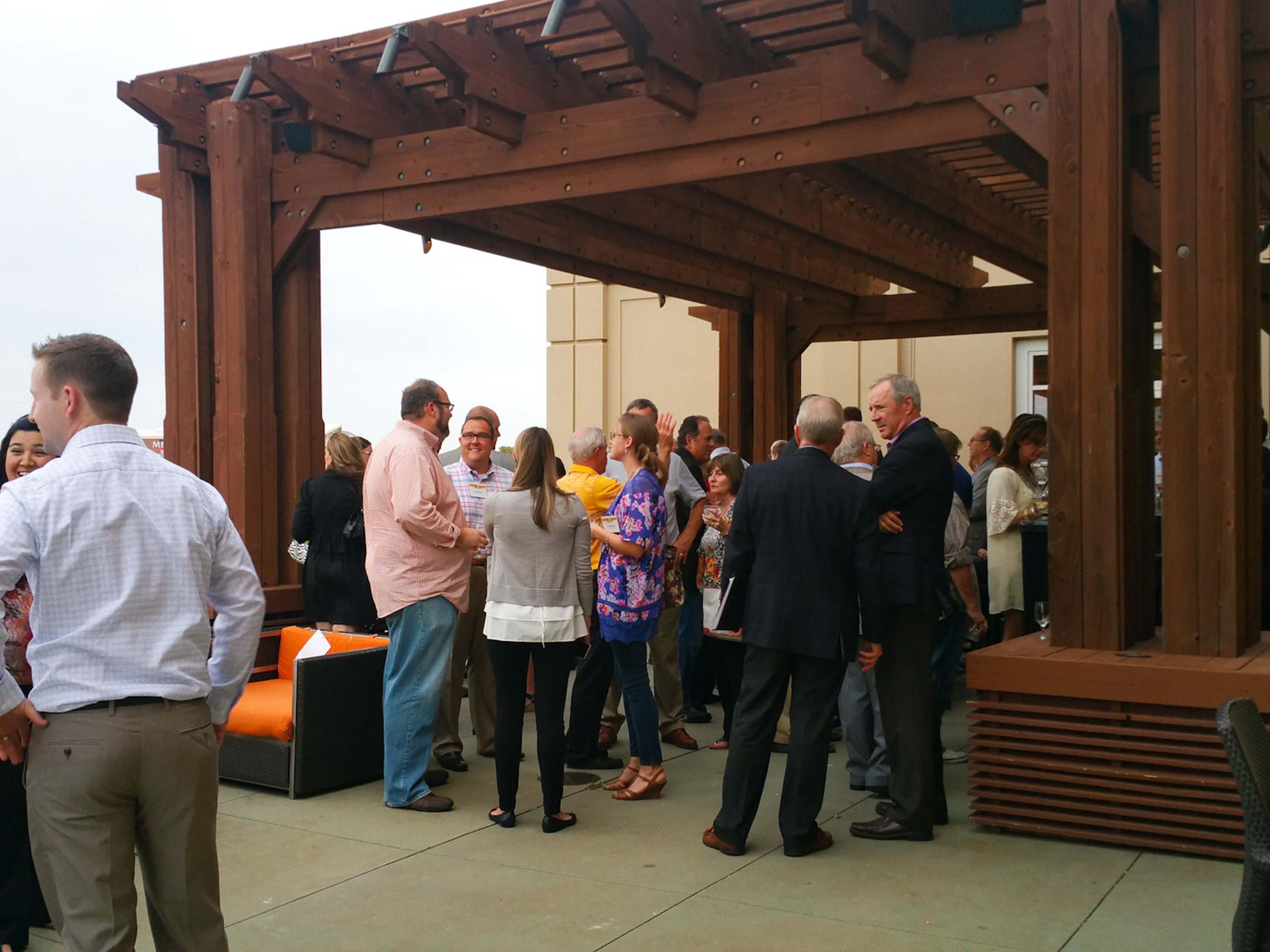 Image of people mingling at a KFBF outdoor event.