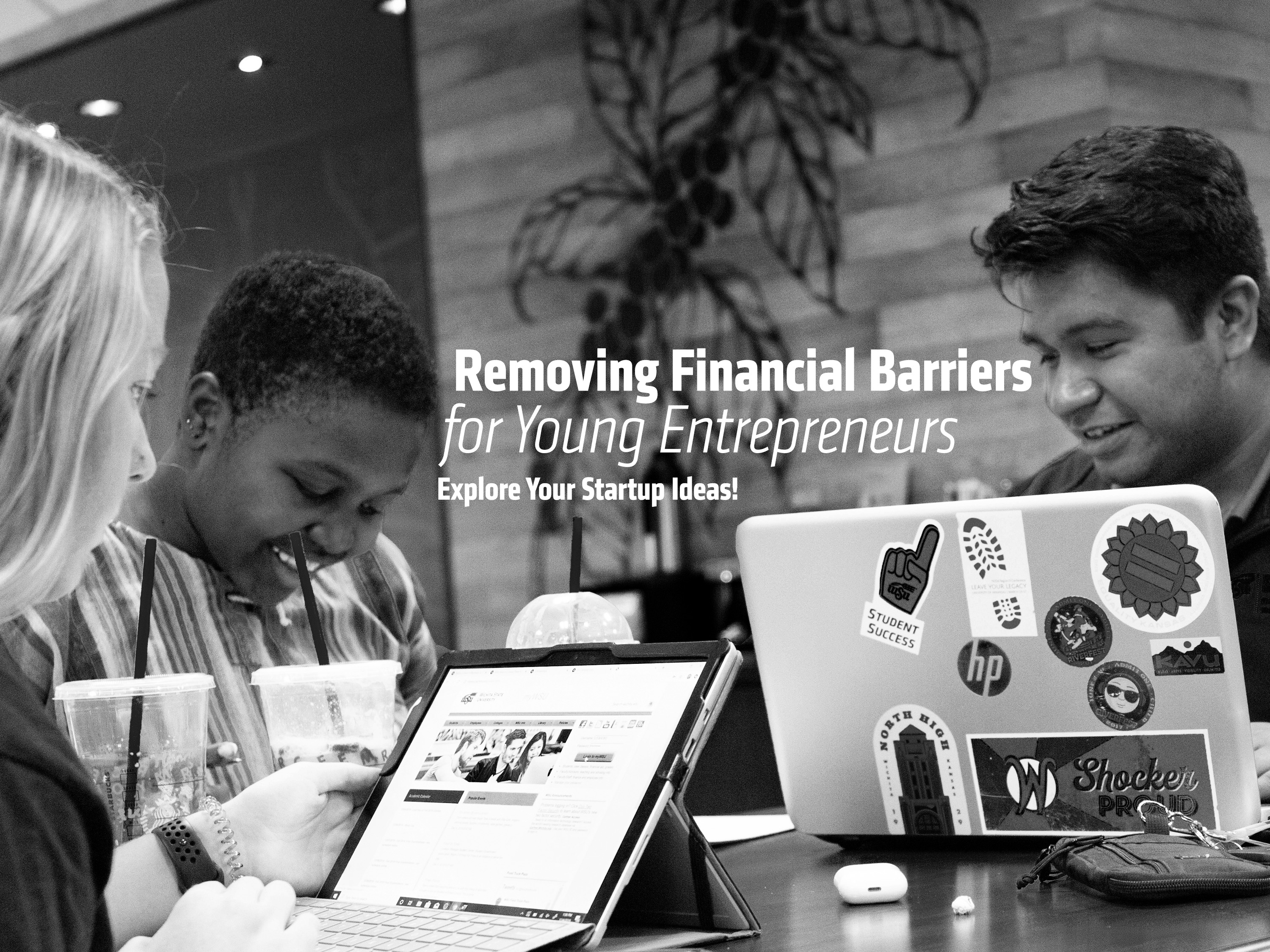 Three students sitting in the Rhatigan Student Center by Starbucks. "Removing financial barriers for young entrepreneurs. Explore your startup ideas!"