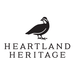 A bird, underneath says heartland heritage