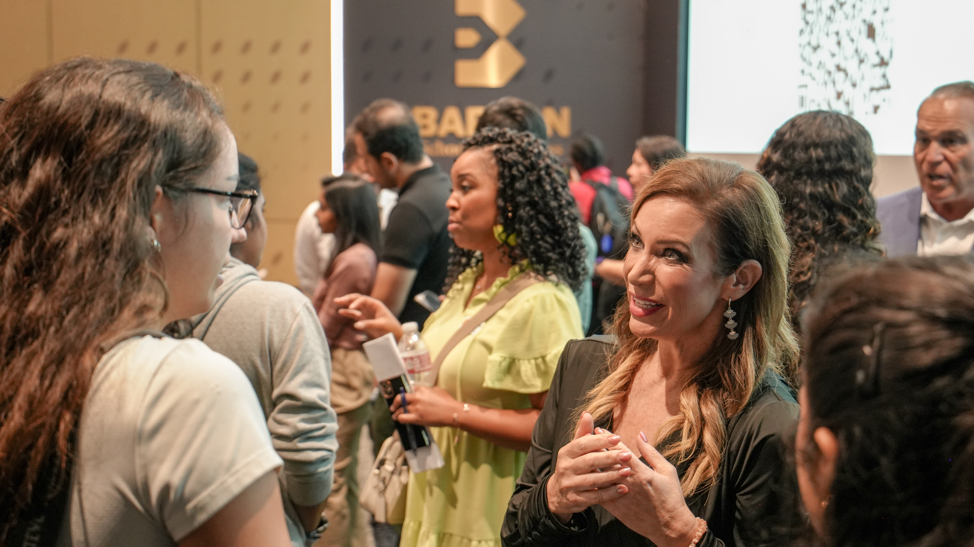 Jaimie Harrison of Meritrust Credit Union interacts with students at the Barton School of Business