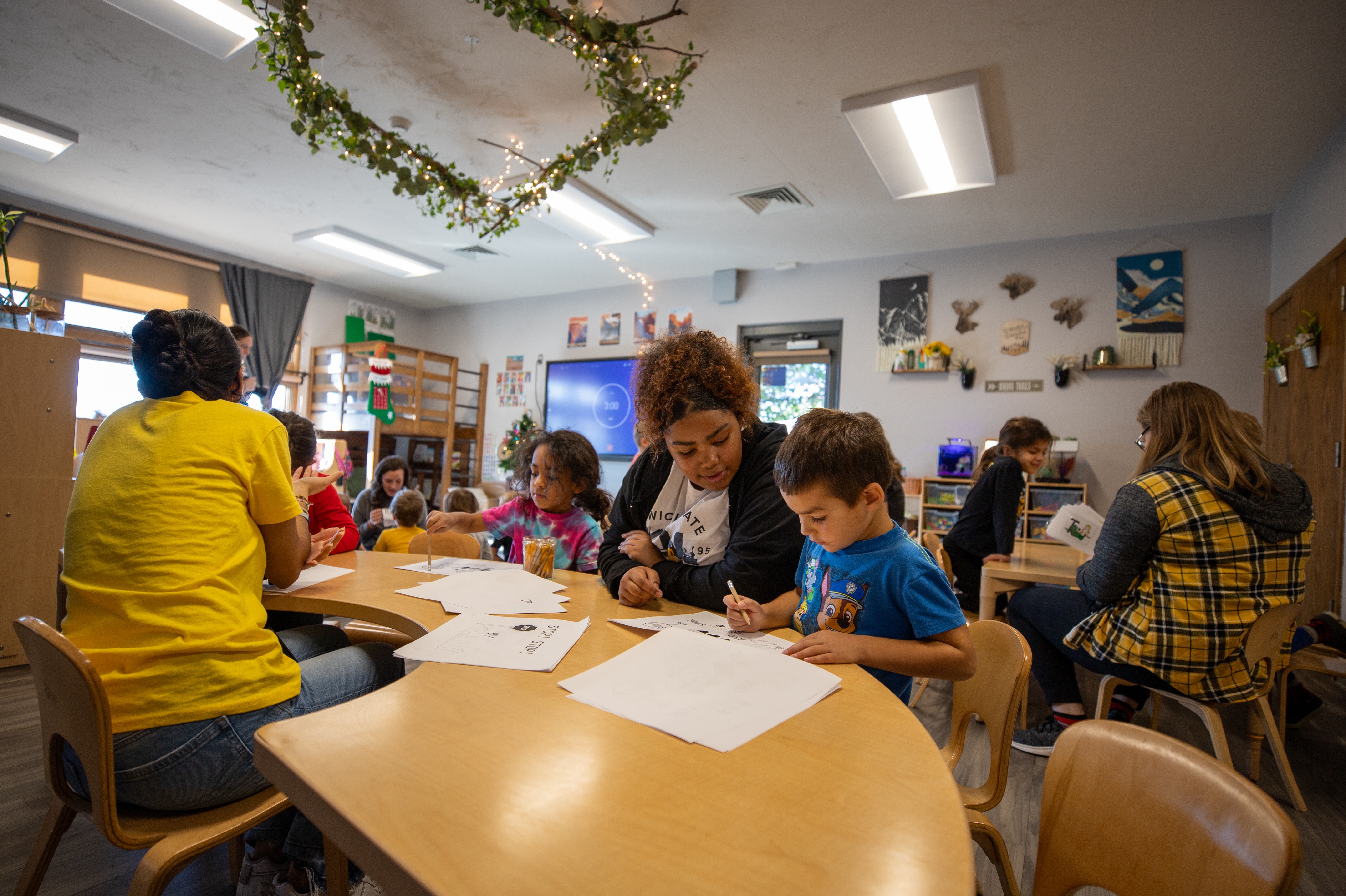Student performing a motion capture exercise while data is displayed on a laptop screen during a demonstration in the Human Performance Lab.