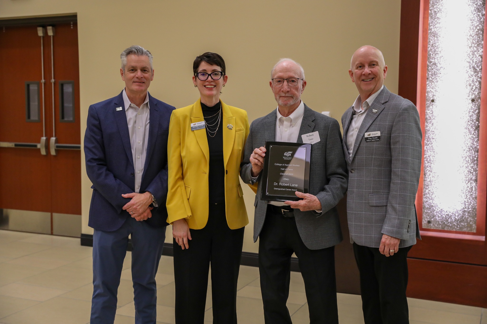 Dr. Robert Lane receives the Distinguished Career Award as part of his induction into the College of Applied Studies Hall of Fame during the 2025 Induction Ceremony in September. Pictured with him are WSU President Dr. Richard Muma, CAS Dean Dr. Jennifer Friend, and CAS Professor Dr. Clay Stoldt. Dr. Robert Lane receives the Distinguished Career Award as part of his induction into the College of Applied Studies Hall of Fame during the 2025 Induction Ceremony in September. Pictured with him are WSU President Dr. Richard Muma, CAS Dean Dr. Jennifer Friend, and CAS Professor Dr. Clay Stoldt.