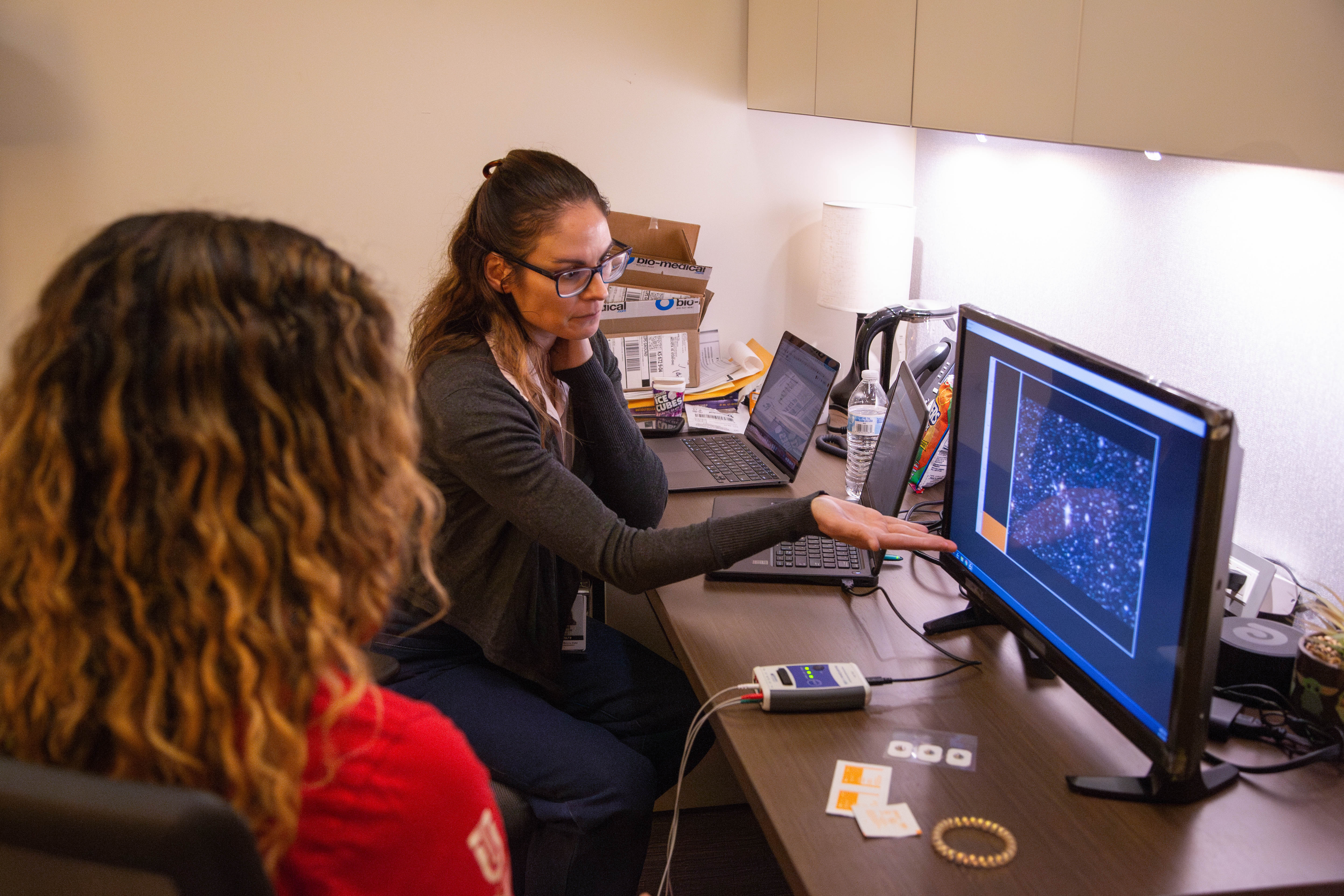 Dr. Claire Gregory with a student participant during a biofeedback study