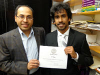 Photo of an Undergraduate receiving an award. 