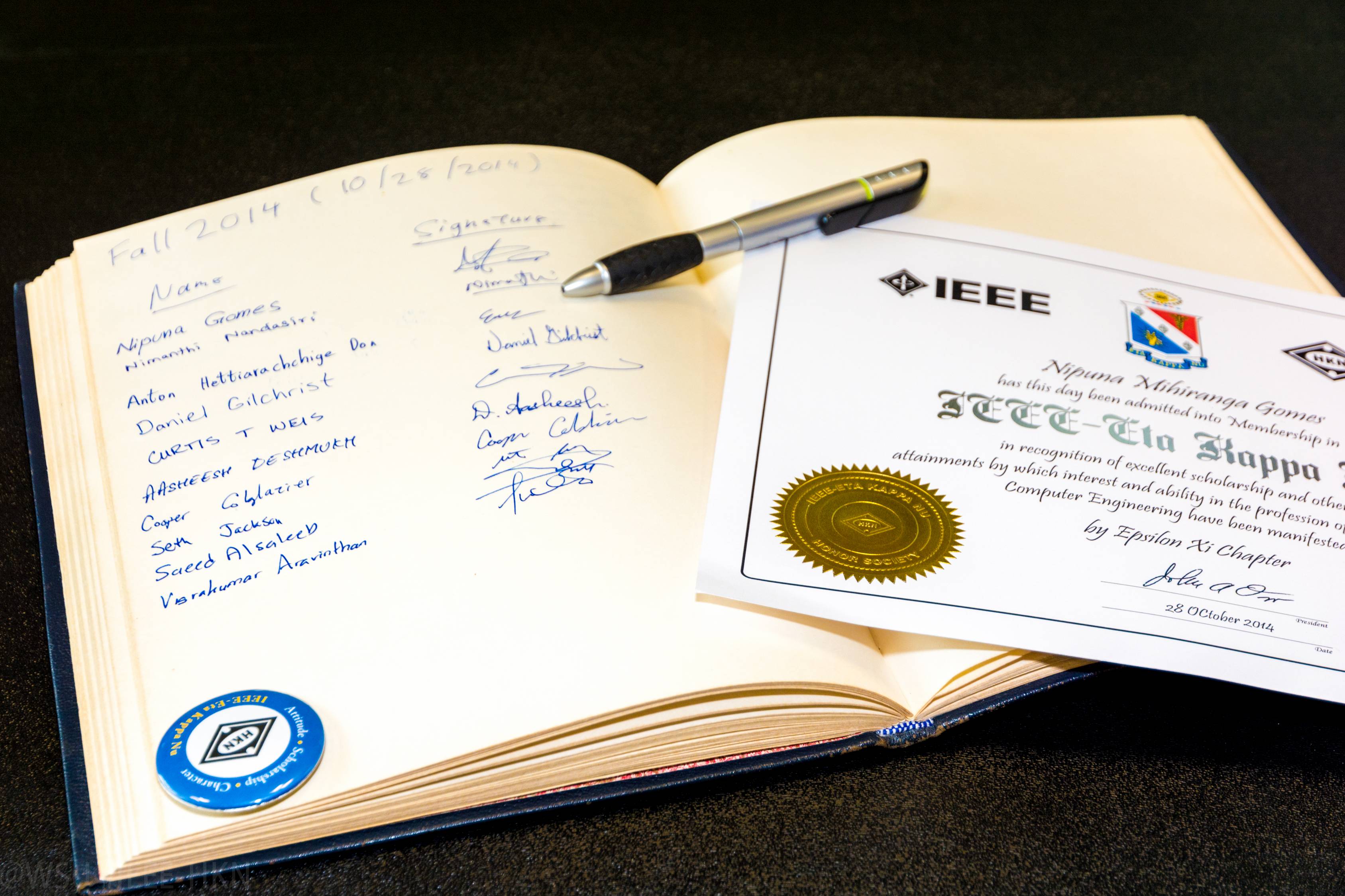 Fall 2014 initiate signature book and certificate. 