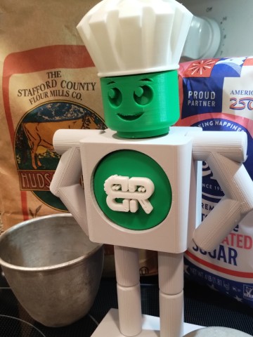 BEST Robotics mascot BEST Robotics mascot in chef's hat and ingredients in background