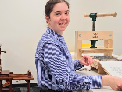 Claire pulling a print off the press Claire pulling a print off the press