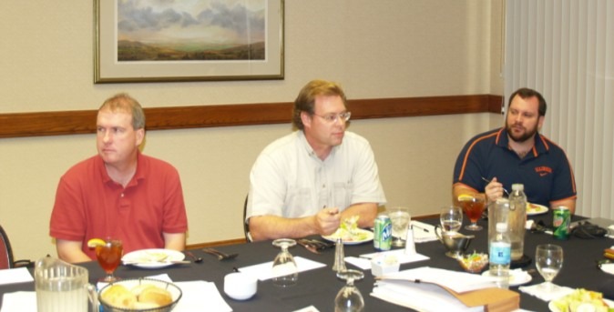 Drs. Dehner, Torbenson, and Owens discussing department issues.