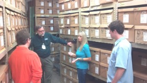 Seth Bate and Austin Rhodes listen to Doug King and Melissa Thompson discuss practices at Sedgwick County Records Management.