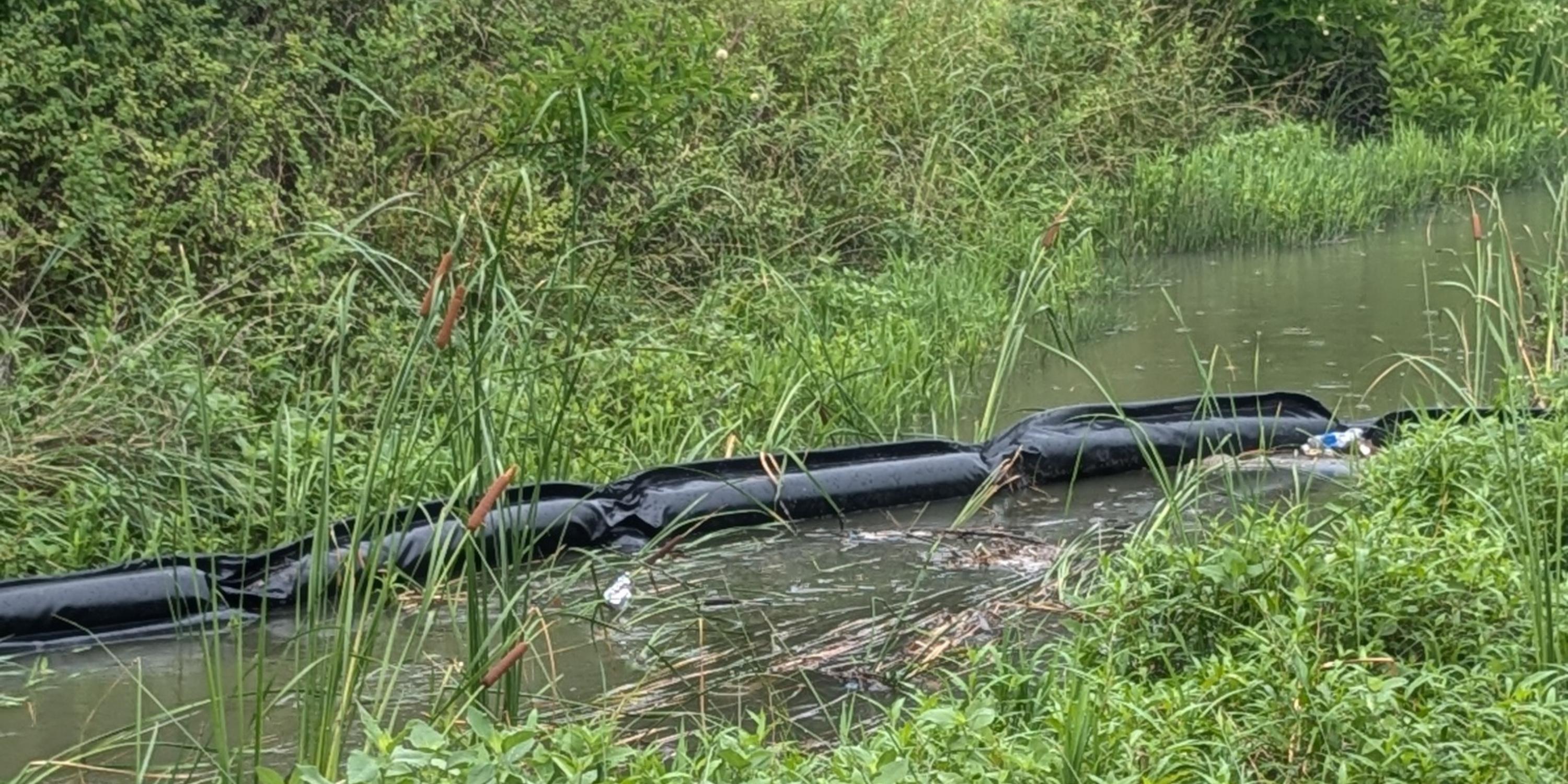 trash trap installed in the Chisolm Creek at Great Plains Nature Center in Wichita Kansas