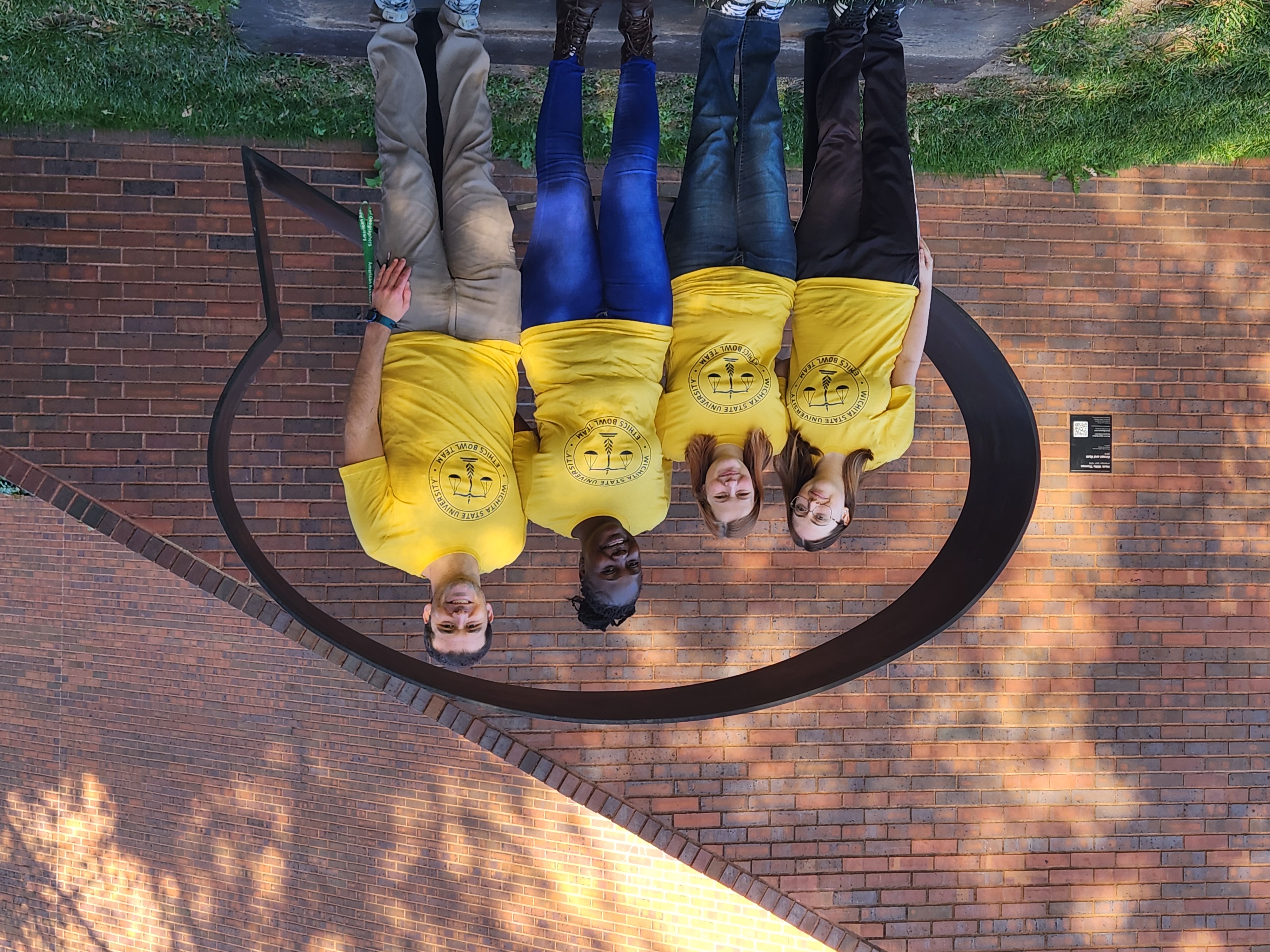 Monique, Isla, Cynthia, and Dr. Clark wearing their Ethics Bowl T-shirts