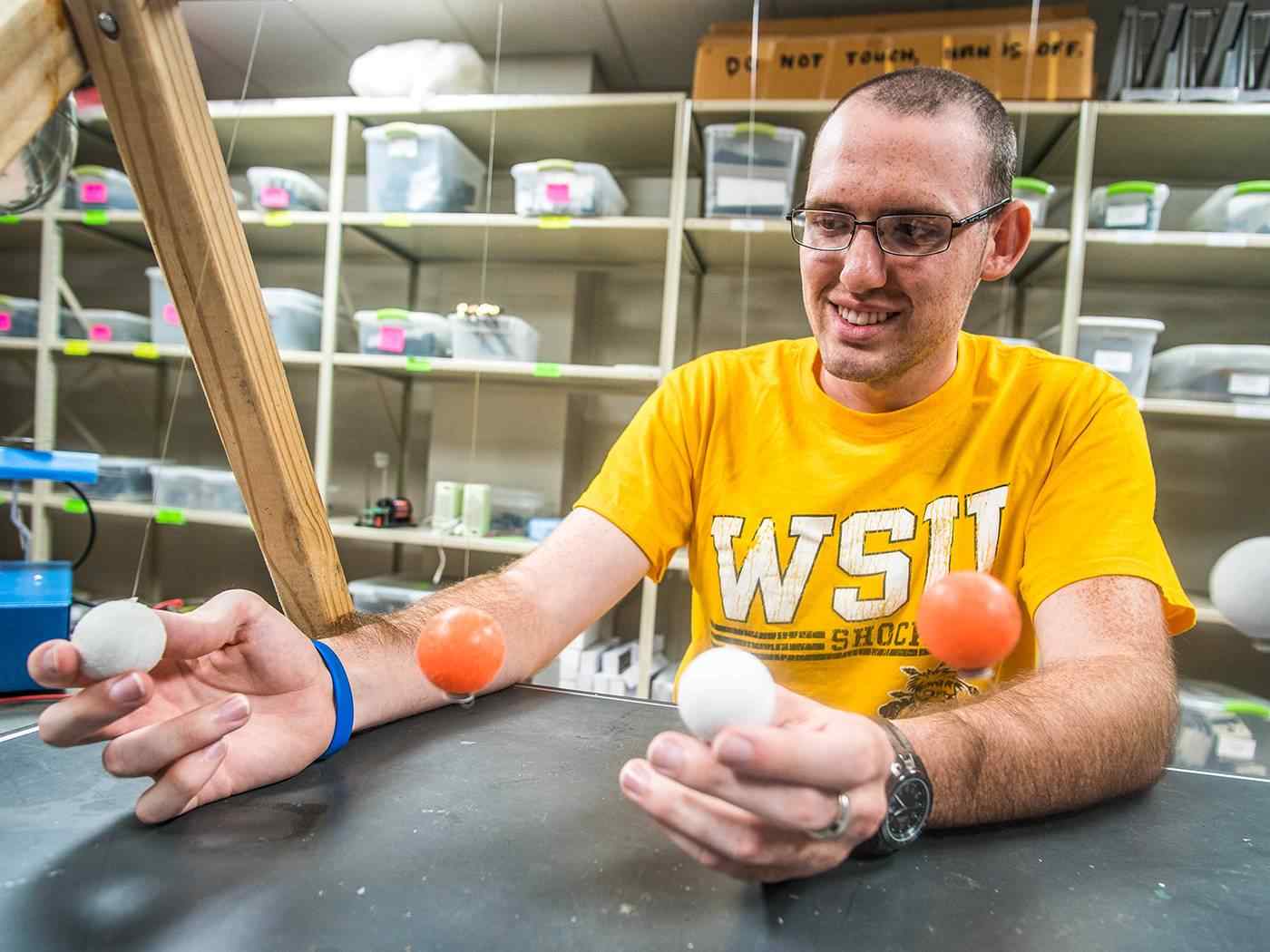 Student experimenting in a physics lab