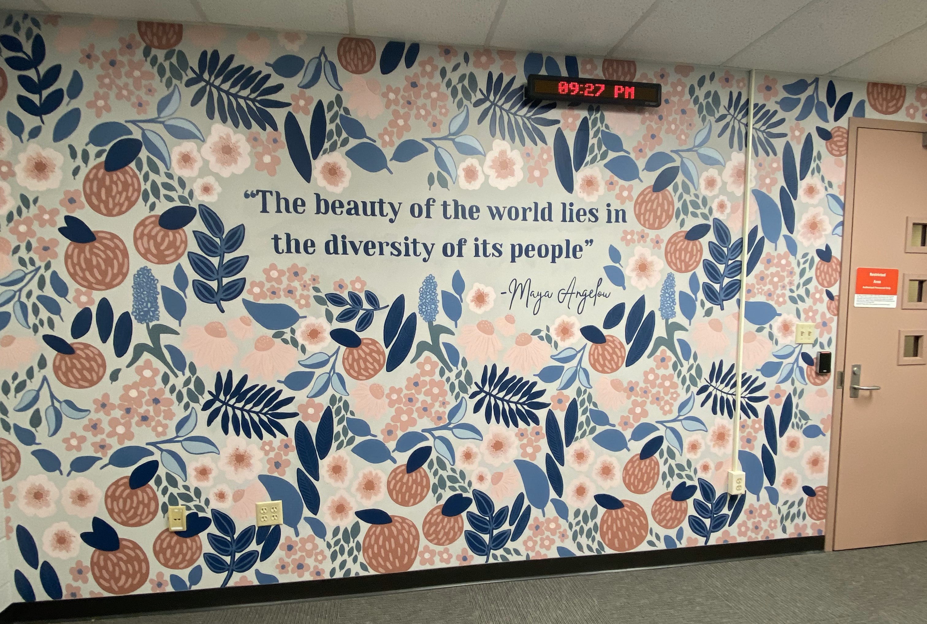 A mural stating "the beauty of the world lies in the diversity of its people" a quote from Maya Angelou