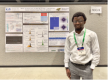 student in front of poster