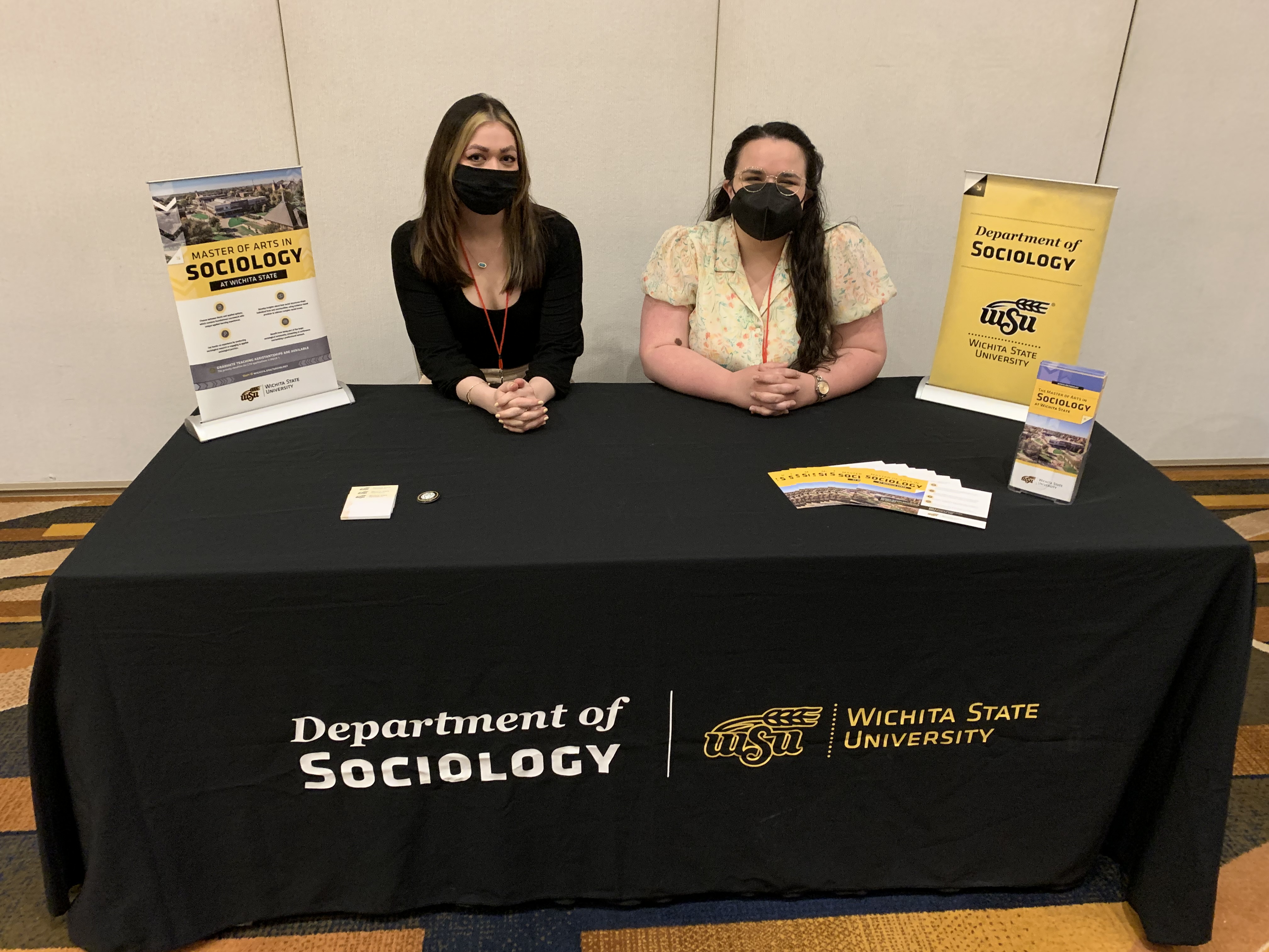 Graduate students promote the sociology program at the 2022 MSS conference.