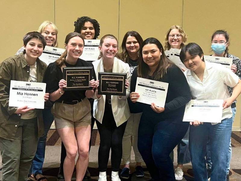 Photo of the Sunflower Staff recieving its awards. The Sunflower Staff won several awards at the Kansas Collegiate Media spring conference.