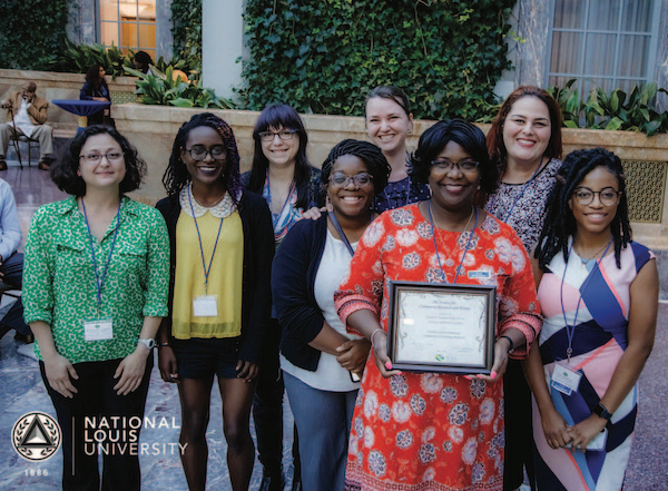 Photo: The Student Membership Circle Bronze Ribbon Award was presented to WSU at the Society for Community Research and Action conference. It recognizes schools with the largest number of graduate students who are also members of the society. Pictured are ROSALIND CANARE, ALISSA BEY, ANDREA JAMIEL, CORA OLSON, HANA SHAHIN, KEYONDA BROOKS, PAIGTON MAYES and RHONDA LEWIS, professor of psychology and chair.