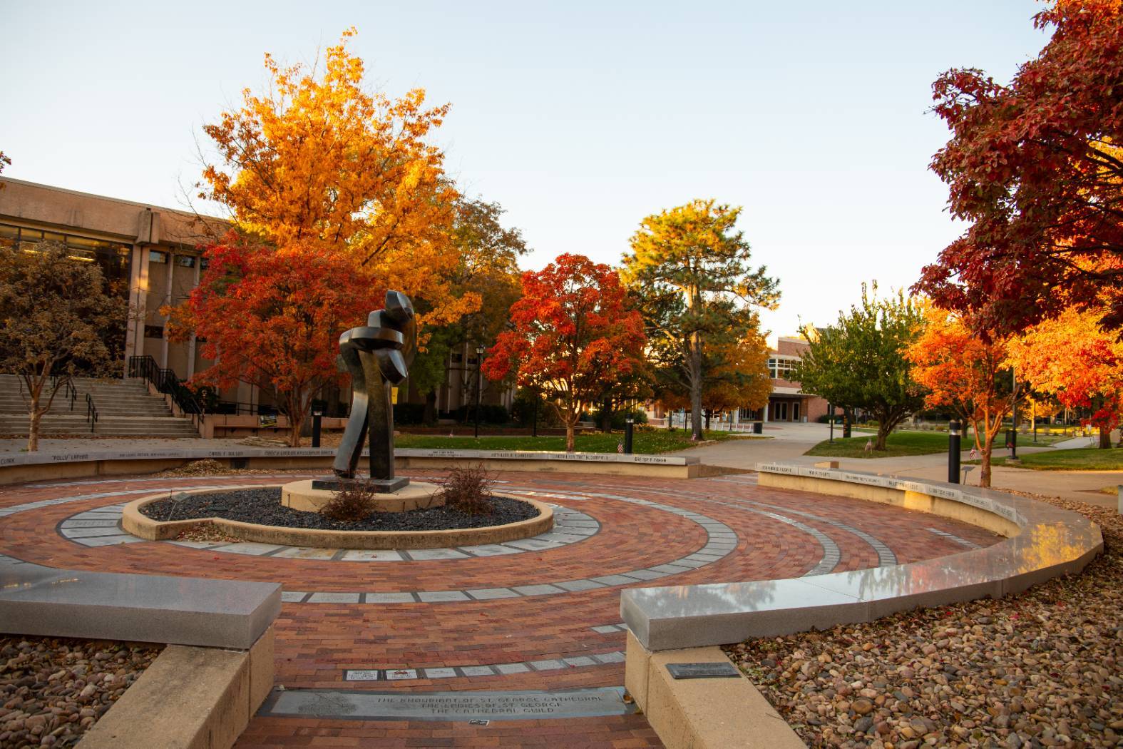 Plaza of Heroines surrounded by autumn trees with vibrant red, orange, and yellow foliage.