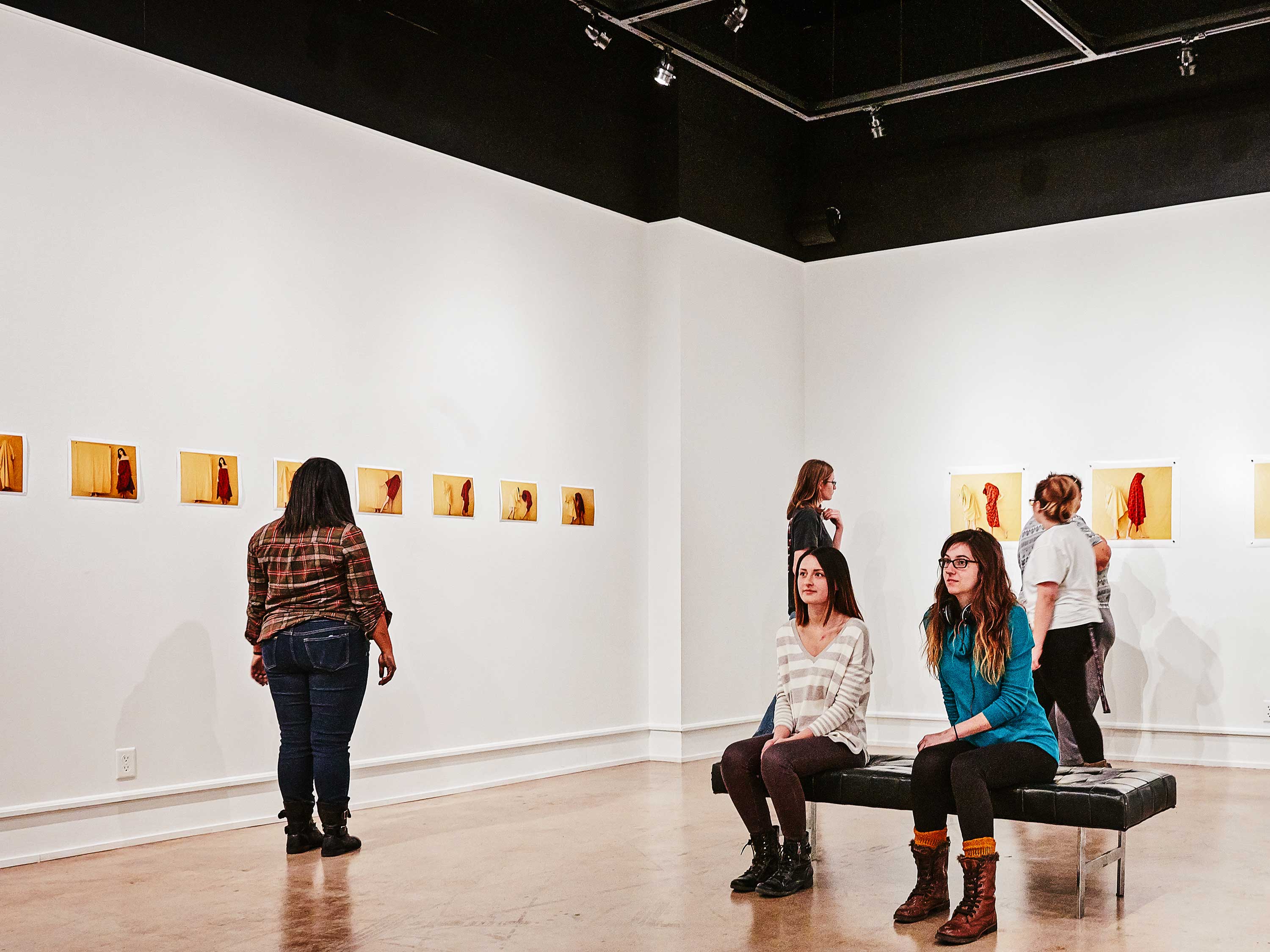 Students take in an exhibition in the Clayton Staples Gallery.
